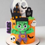 Topo de Bolo Halloween Frankenstein infantil com castelo assombrado, lua cheia, morcegos, fantasma, caveira e nome Alex.